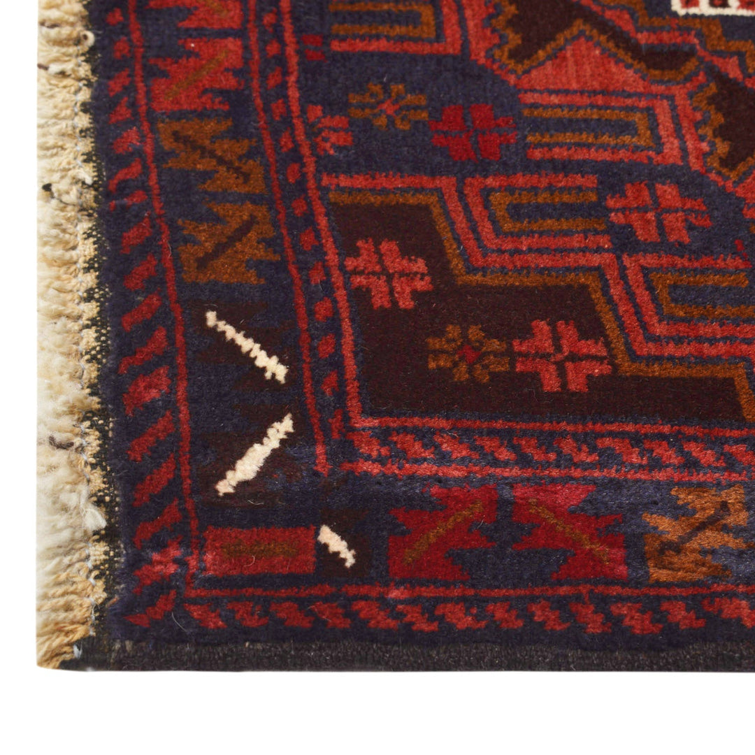 Afghan Baluchi Rug 3' 0" x 5' 6" Hand-Knotted close-up