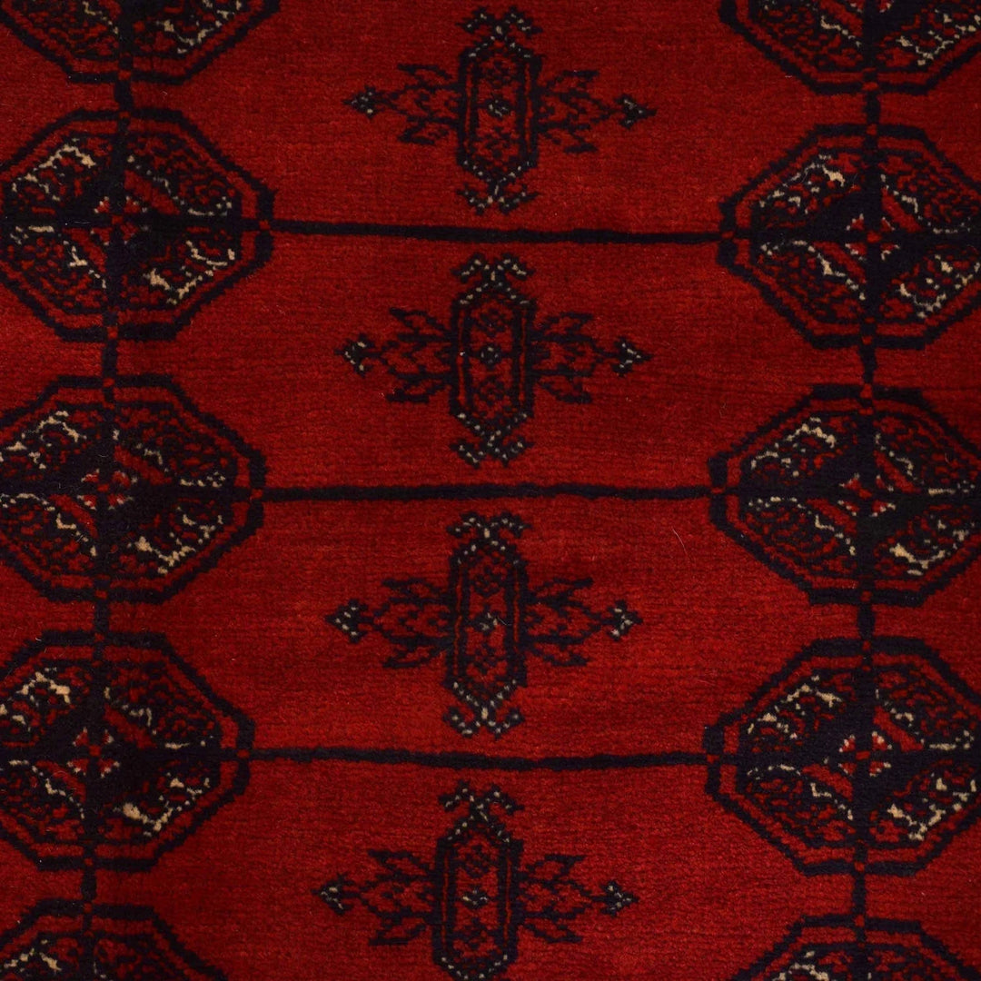 Red Afghan Bokhara Rug 6' 9" x 9' 7" Hand-Knotted | No. AL58569