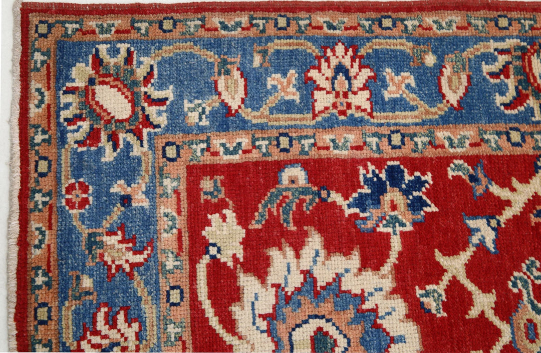 Red Afghan Oriental Rug 4'1" x 6'0" Hand-Knotted close-up