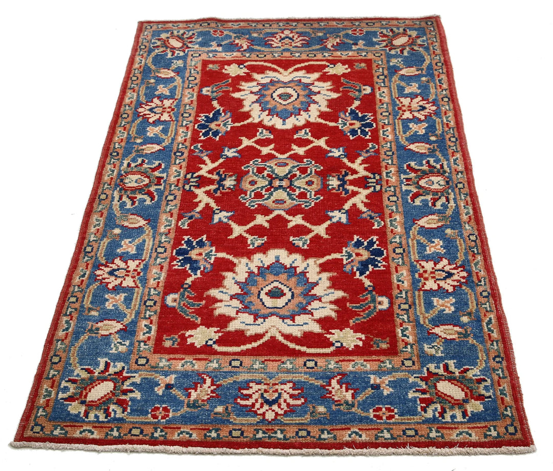 Red Afghan Oriental Rug 4'1" x 6'0" Hand-Knotted texture