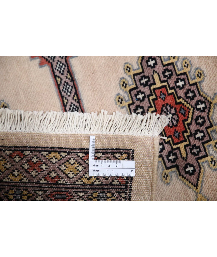 Ivory Pakistani Bokhara Rug 2' 7" x 9' 10" Hand-Knotted | No. AT28881