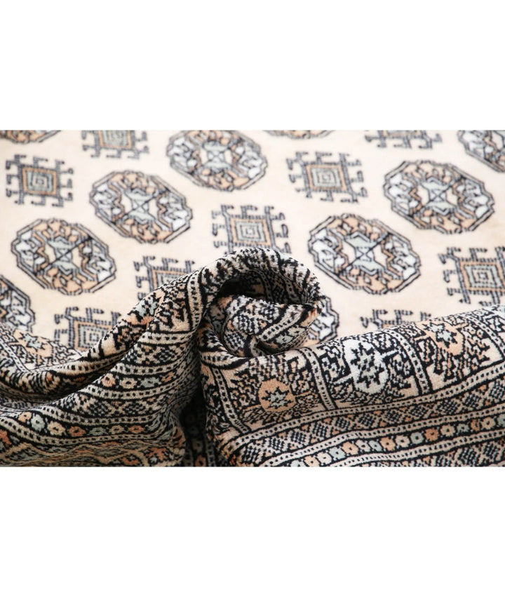 Ivory Pakistani Bokhara Rug 9' 0" x 11' 11" Hand-Knotted | No. AT29782