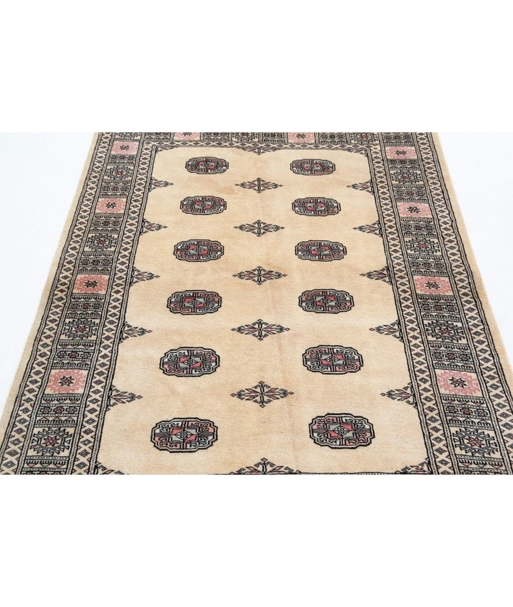 Ivory Pakistani Tribal Rug 4' 1" x 5' 10" Hand-Knotted close-up