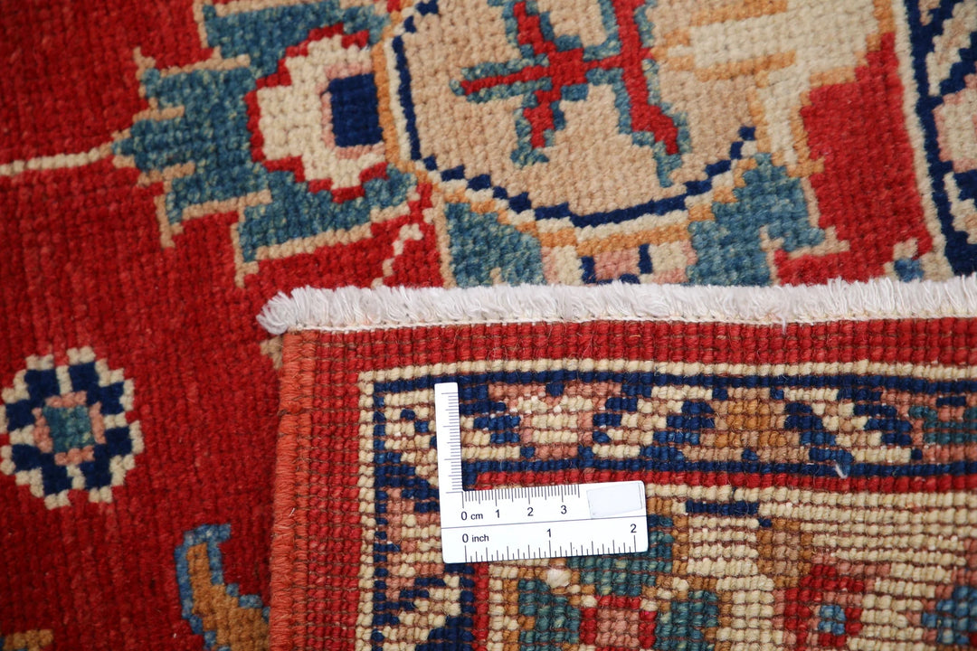 Red Afghan Oriental Rug 3' 1" x 4' 8" Hand-Knotted close-up