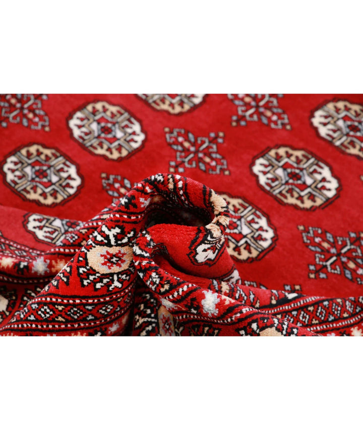 Red Pakistani Bokhara Rug 6' 0" x 8' 10" Hand-Knotted | No. AT97899