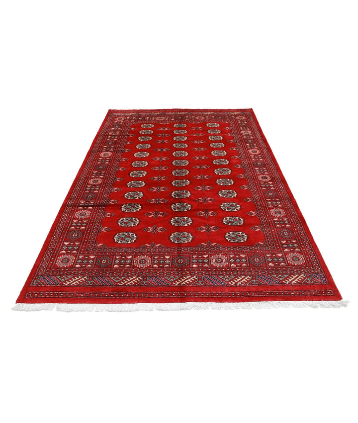 Red Pakistani Tribal Rug 5'7" x 8'7" Hand-Knotted pattern