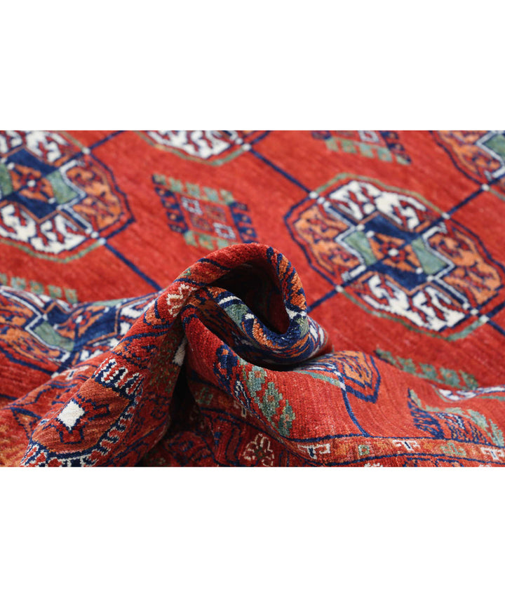 Rust Afghan Bokhara Rug 6' 4" x 9' 6" Hand-Knotted | No. AT27697