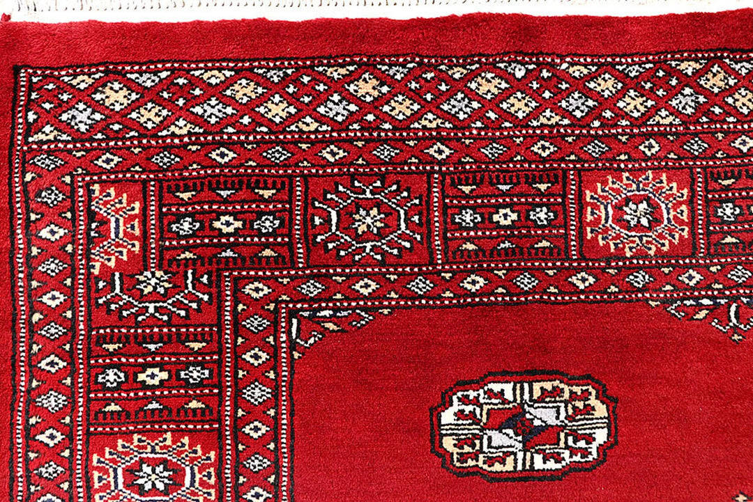 Red Pakistani Bokhara Rug 4' 1" x 6' 2" Hand-Knotted | No. QA10857