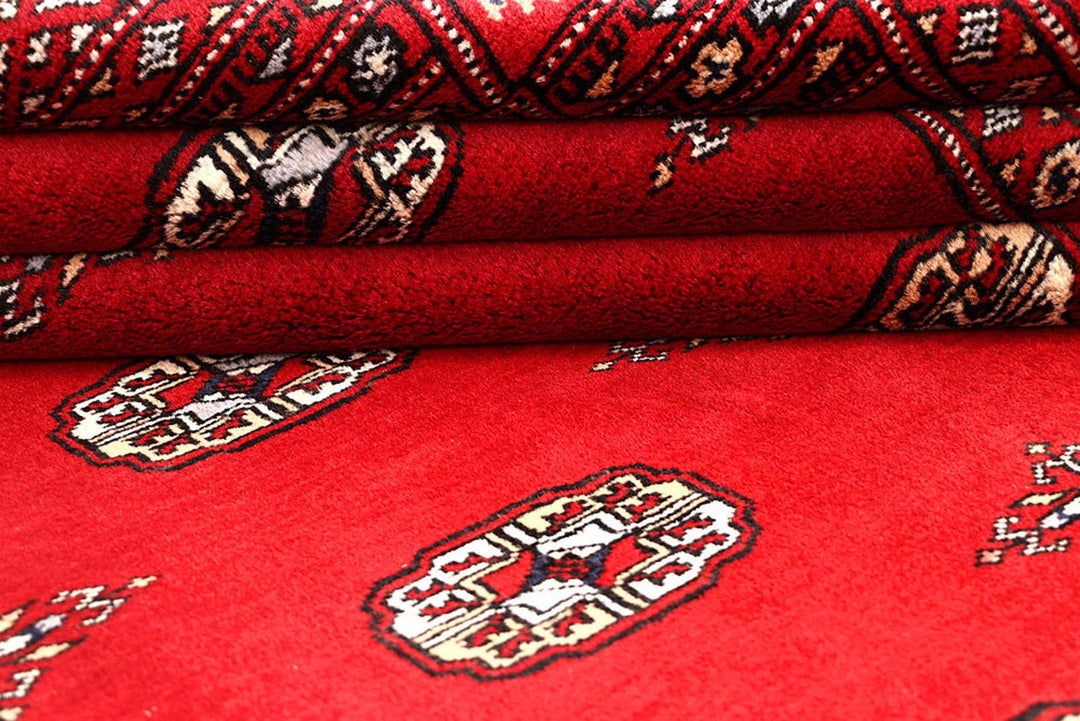 Red Pakistani Bokhara Rug 4' 1" x 6' 2" Hand-Knotted | No. QA10857