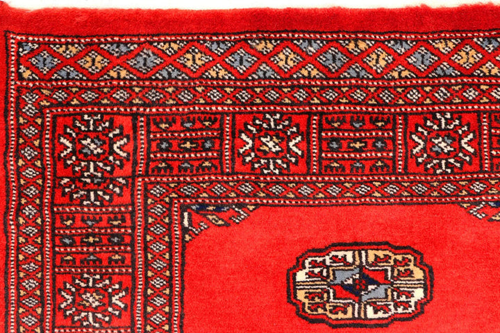 Red Pakistani Bokhara Rug 2' 7" x 11' 5" Hand-Knotted | No. QA13228