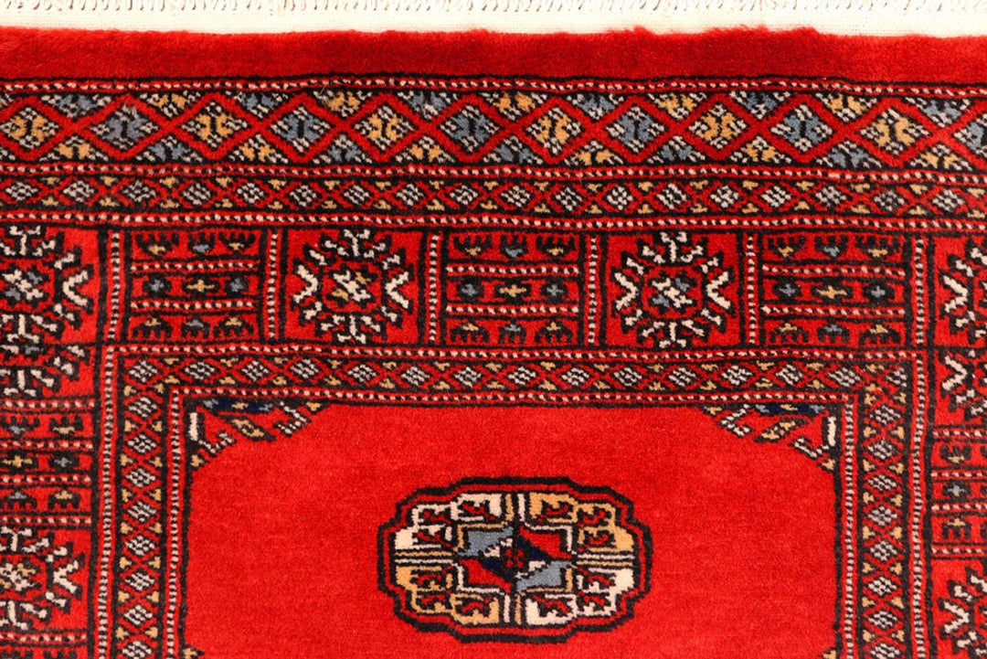 Red Pakistani Bokhara Rug 2' 7" x 11' 5" Hand-Knotted | No. QA13228