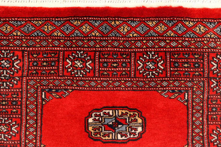 Red Pakistani Bokhara Rug 2' 7" x 11' 5" Hand-Knotted | No. QA13228