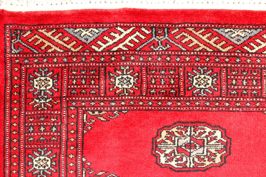 Red Pakistani Bokhara Rug 2' 7" x 8' 10" Hand-Knotted | No. QA13632