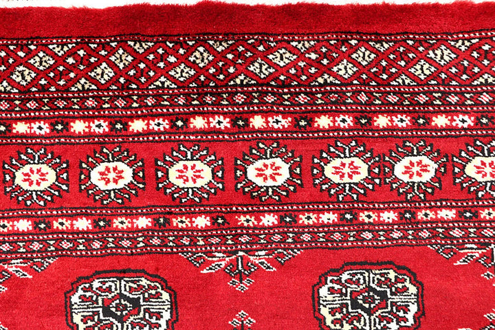 Red Pakistani Bokhara Rug 3' 11" x 6' 6" Hand-Knotted | No. QA13964