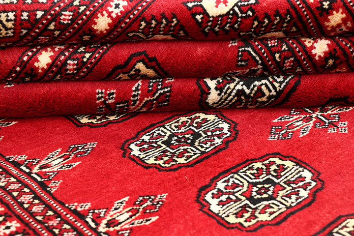 Red Pakistani Bokhara Rug 3' 11" x 6' 6" Hand-Knotted | No. QA13964