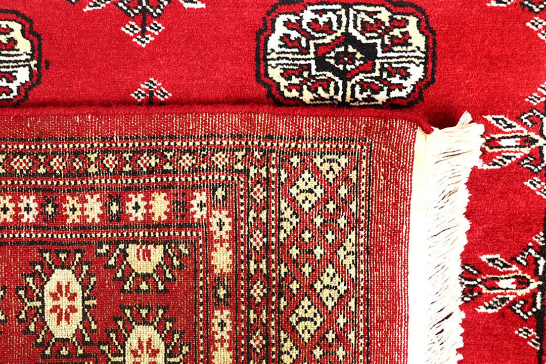 Red Pakistani Bokhara Rug 3' 11" x 6' 6" Hand-Knotted | No. QA13964