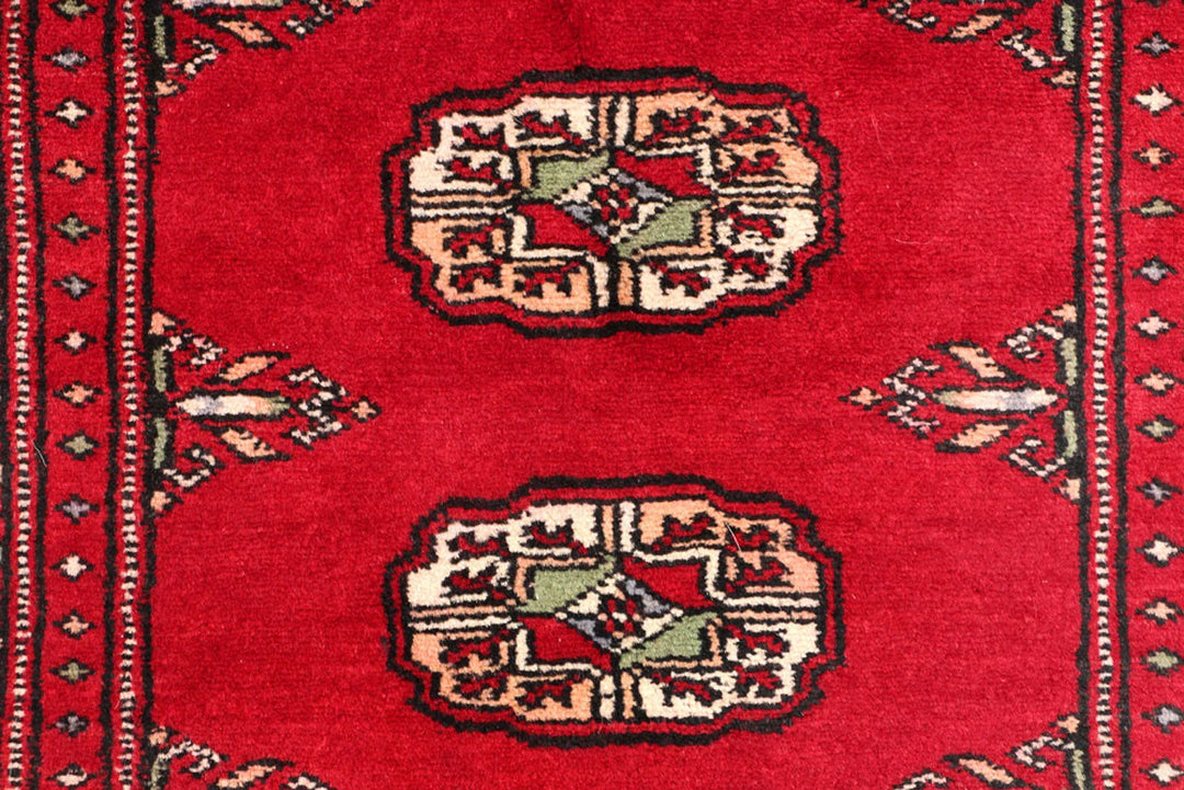 Red Pakistani Bokhara Rug 2' 1" x 5' 8" Hand-Knotted | No. QA14525