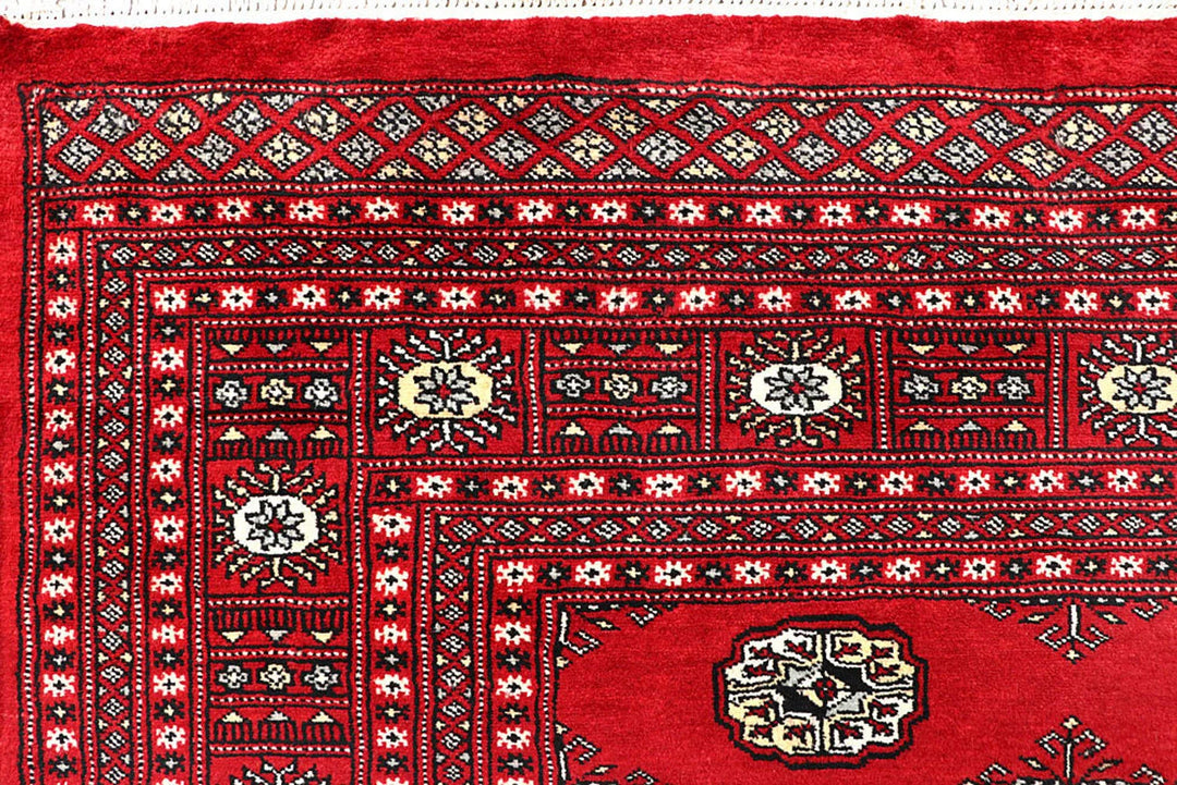 Red Pakistani Bokhara Rug 6' 1" x 8' 11" Hand-Knotted | No. QA15645