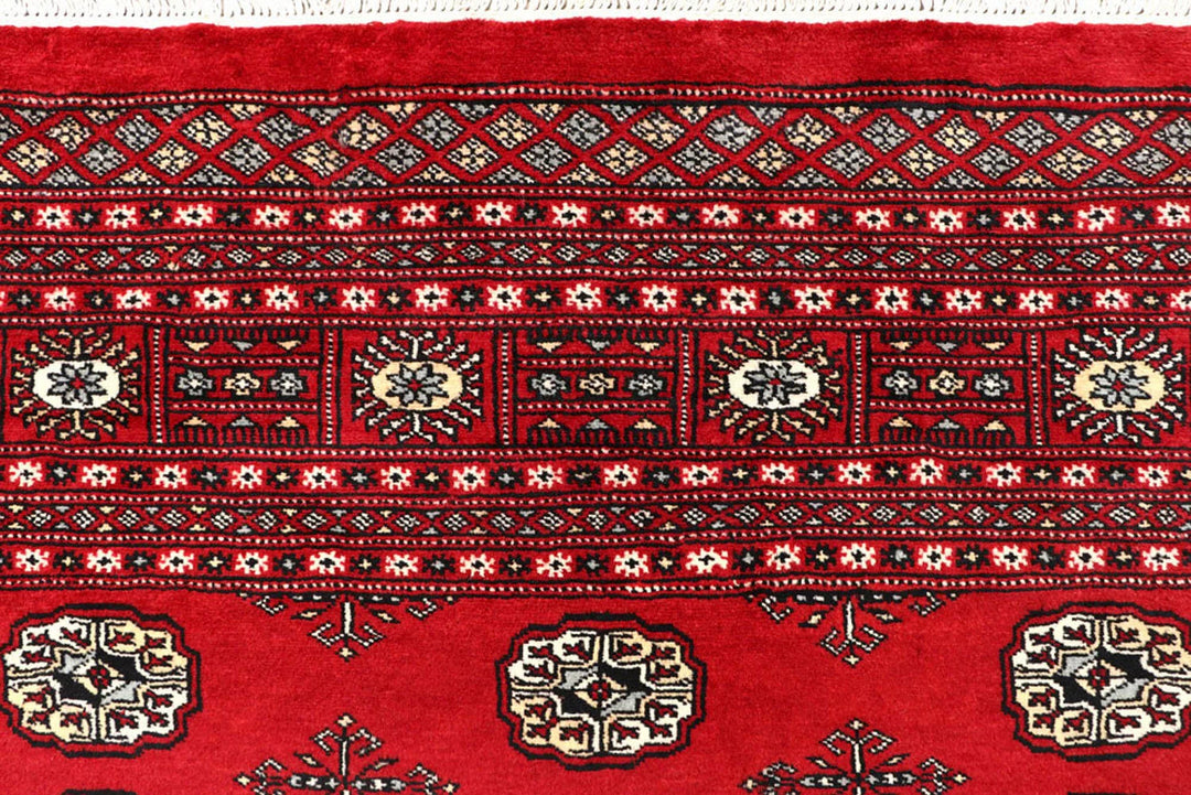 Red Pakistani Bokhara Rug 6' 1" x 8' 11" Hand-Knotted | No. QA15645