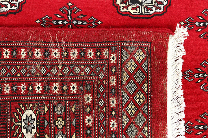 Red Pakistani Bokhara Rug 6' 1" x 8' 11" Hand-Knotted | No. QA15645
