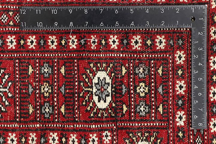 Red Pakistani Bokhara Rug 6' 1" x 8' 11" Hand-Knotted | No. QA15645