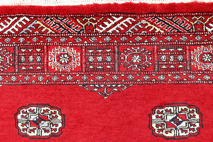 Red Pakistani Bokhara Rug 4' 2" x 6' 7" Hand-Knotted | No. QA15941