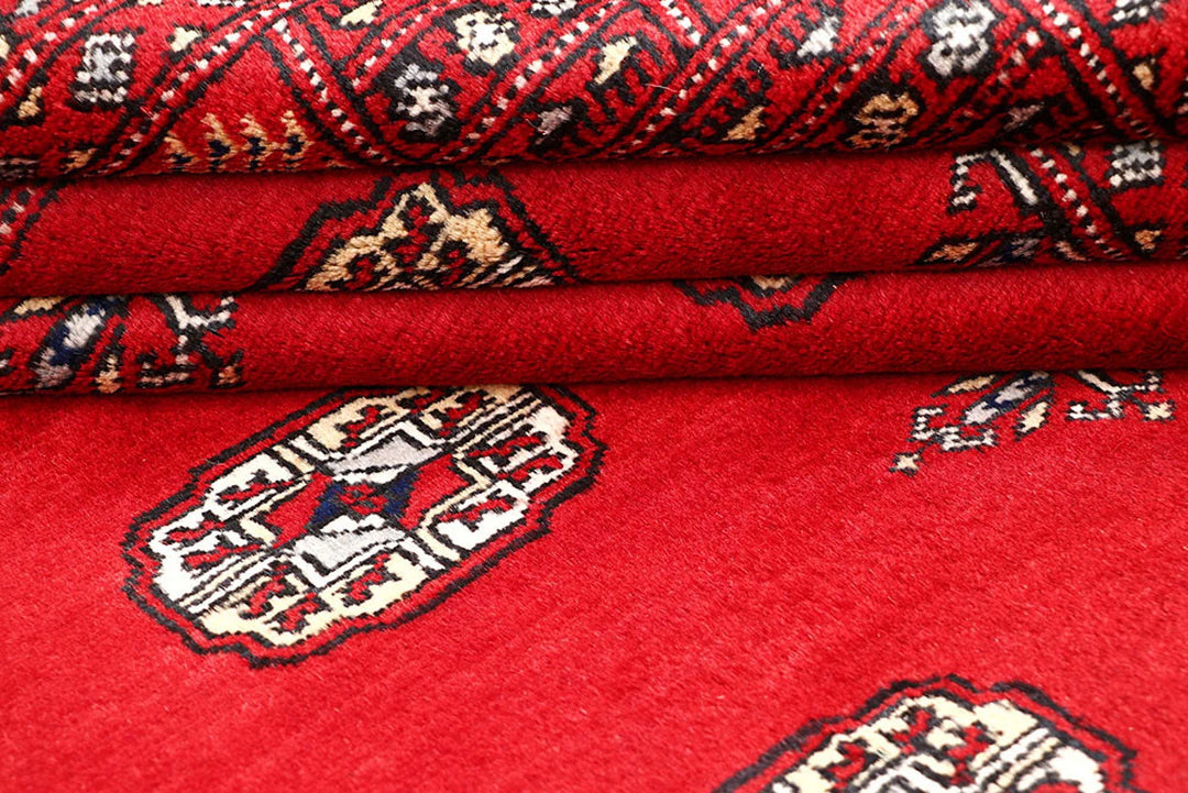 Red Pakistani Bokhara Rug 4' 2" x 6' 7" Hand-Knotted | No. QA15941