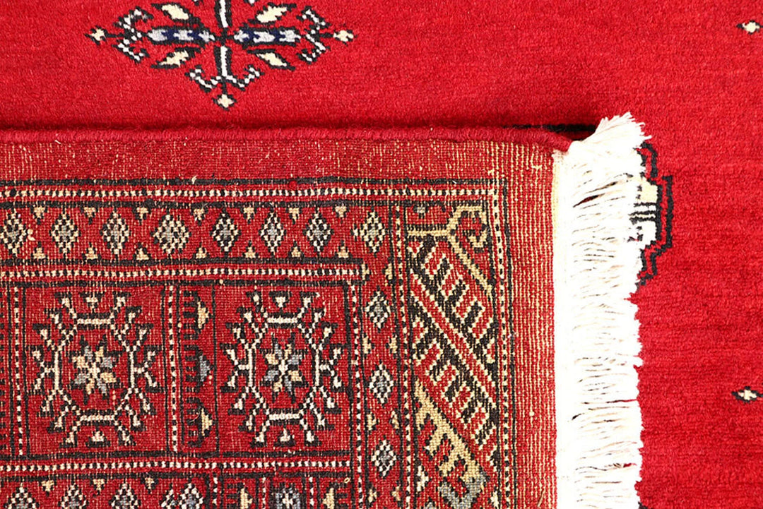 Red Pakistani Bokhara Rug 4' 2" x 6' 7" Hand-Knotted | No. QA15941