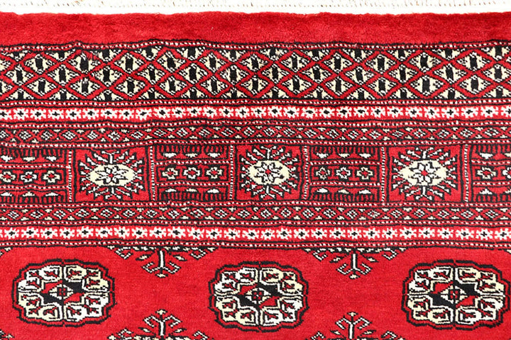 Firebrick Pakistani Bokhara Rug 5' 1" x 8' Hand-Knotted | No. QA16041