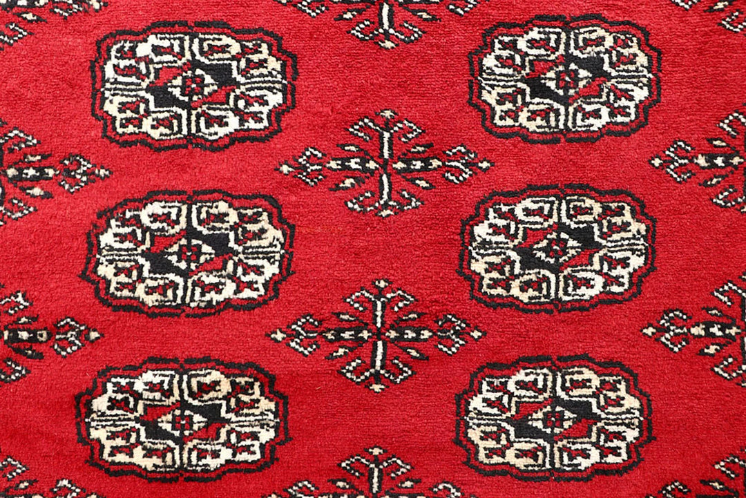 Firebrick Pakistani Bokhara Rug 5' 1" x 8' Hand-Knotted | No. QA16041
