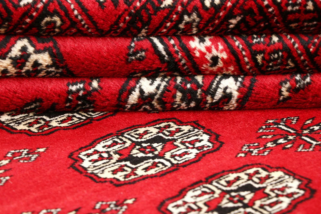 Firebrick Pakistani Bokhara Rug 5' 1" x 8' Hand-Knotted | No. QA16041