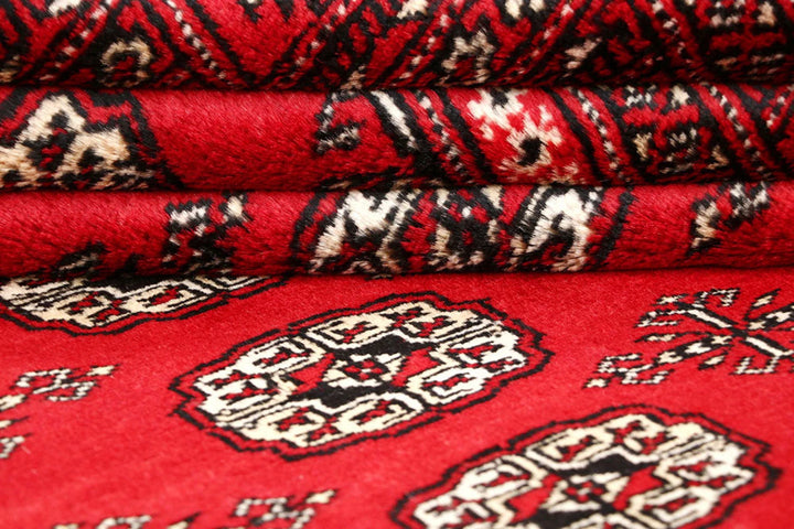 Firebrick Pakistani Bokhara Rug 5' 1" x 8' Hand-Knotted | No. QA16041