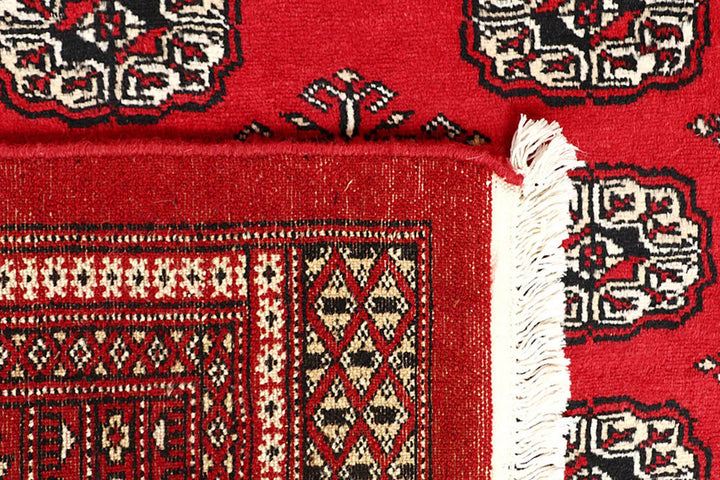 Firebrick Pakistani Bokhara Rug 5' 1" x 8' Hand-Knotted | No. QA16041