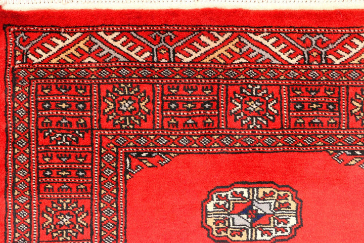 Red Pakistani Bokhara Rug 2' 7" x 11' 8" Hand-Knotted | No. QA18298