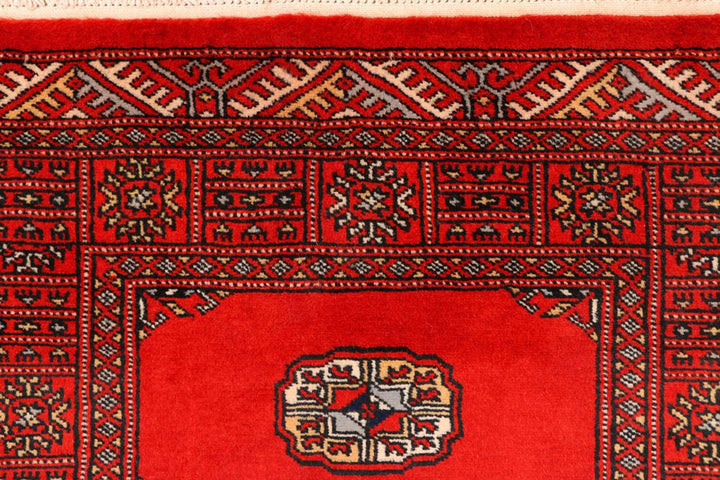 Red Pakistani Bokhara Rug 2' 7" x 11' 8" Hand-Knotted | No. QA18298