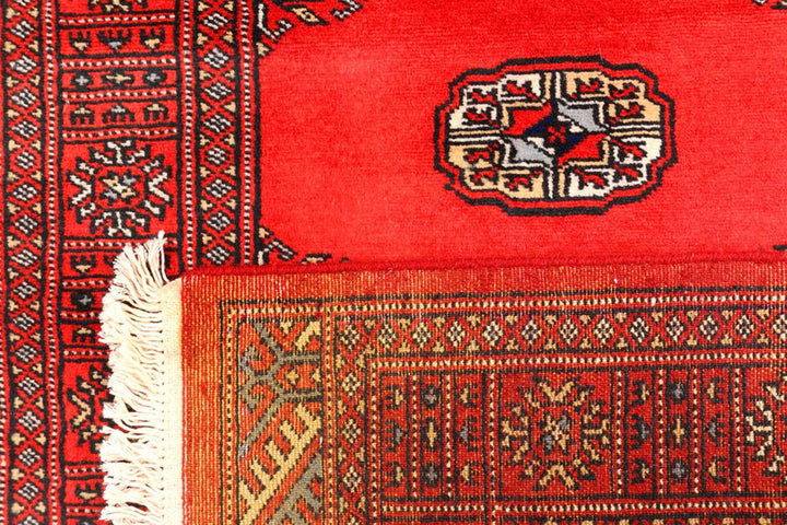 Red Pakistani Bokhara Rug 2' 7" x 11' 8" Hand-Knotted | No. QA18298