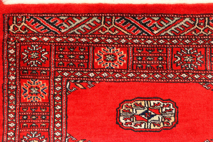 Red Pakistani Bokhara Rug 2' 7" x 11' 10" Hand-Knotted | No. QA18444