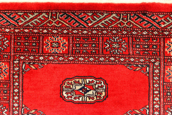 Red Pakistani Bokhara Rug 2' 7" x 11' 10" Hand-Knotted | No. QA18444