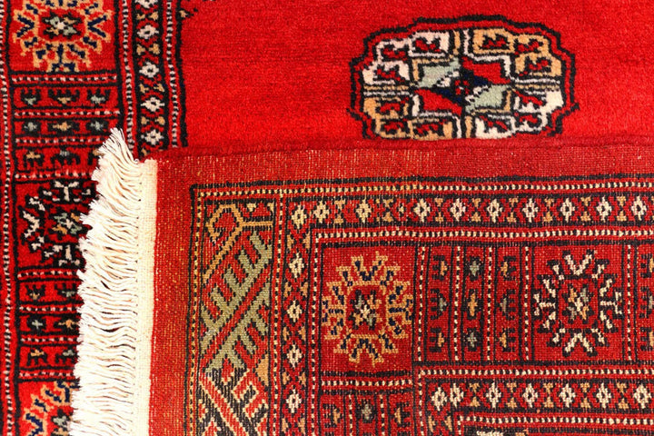 Red Pakistani Bokhara Rug 2' 7" x 11' 10" Hand-Knotted | No. QA18444