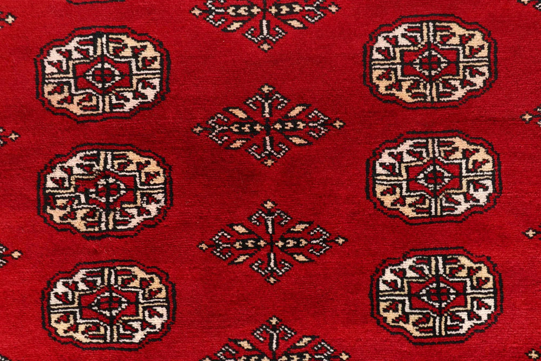 Red Pakistani Bokhara Rug 8' x 10' Hand-Knotted | No. QA18511