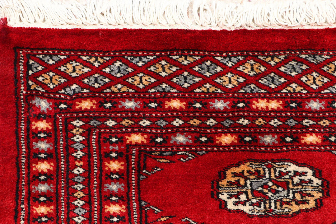 Dark Red Pakistani Bokhara Rug 2' 2" x 5' 9" Hand-Knotted | No. QA19403