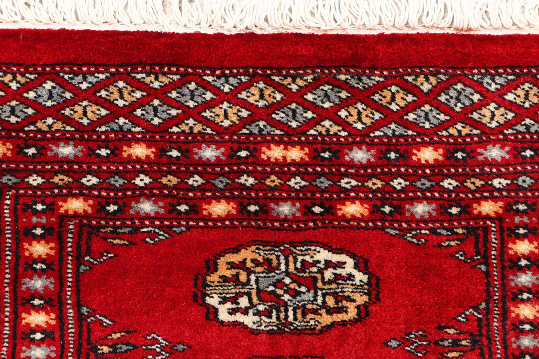 Dark Red Pakistani Bokhara Rug 2' 2" x 5' 9" Hand-Knotted | No. QA19403
