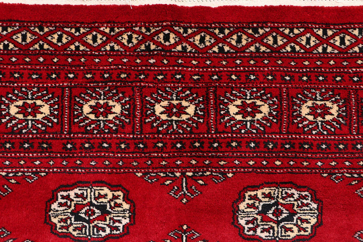Red Pakistani Bokhara Rug 4' 1" x 6' 2" Hand-Knotted | No. QA19481
