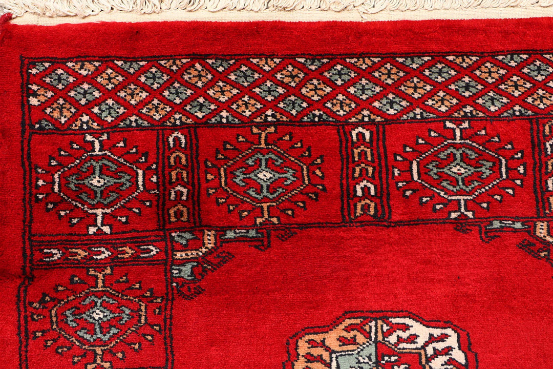Red Pakistani Bokhara Rug 2' 7" x 9' 6" Hand-Knotted | No. QA19812