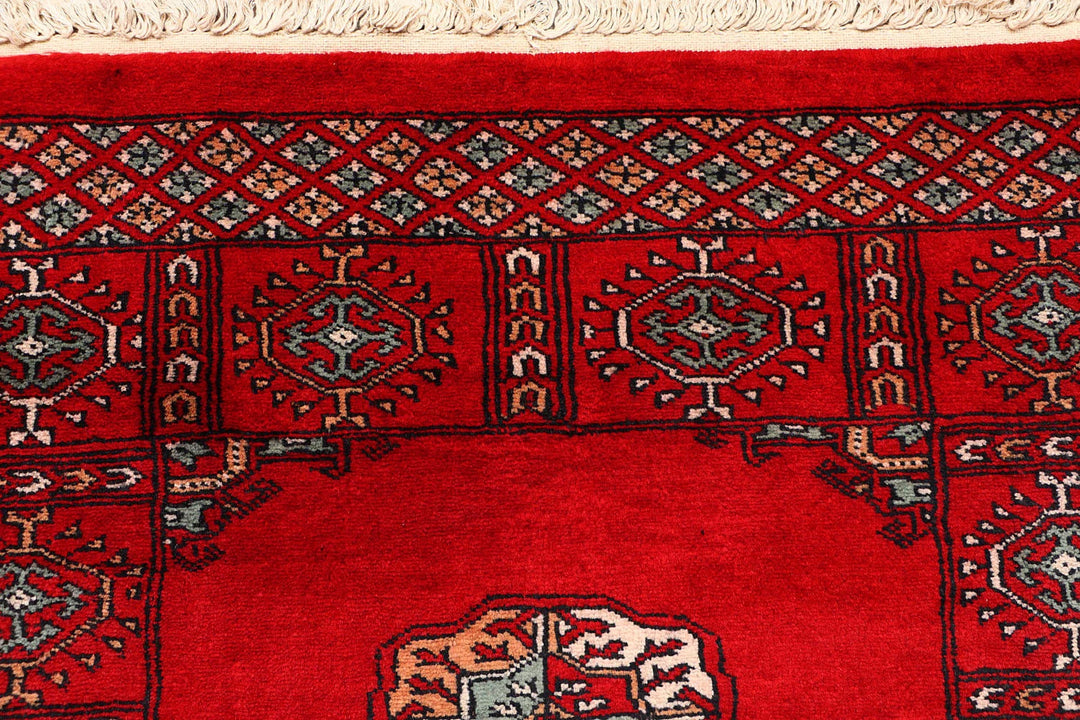 Red Pakistani Bokhara Rug 2' 7" x 9' 6" Hand-Knotted | No. QA19812