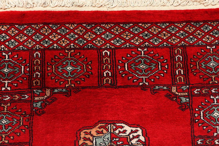 Red Pakistani Bokhara Rug 2' 7" x 9' 6" Hand-Knotted | No. QA19812