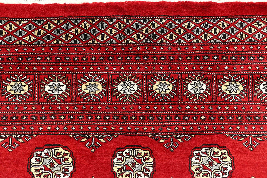 Red Pakistani Bokhara Rug 6' 6" x 9' 2" Hand-Knotted | No. QA20110