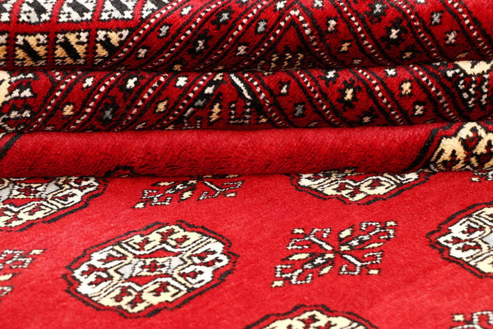 Red Pakistani Bokhara Rug 6' 6" x 9' 2" Hand-Knotted | No. QA20110