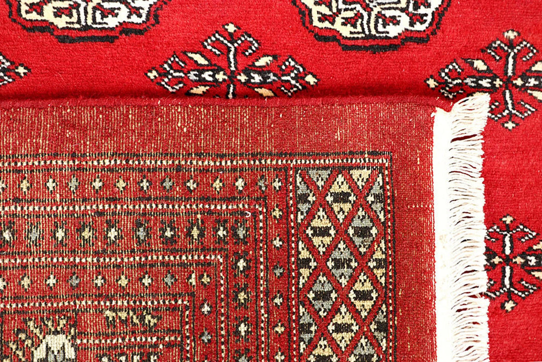 Red Pakistani Bokhara Rug 6' 6" x 9' 2" Hand-Knotted | No. QA20110
