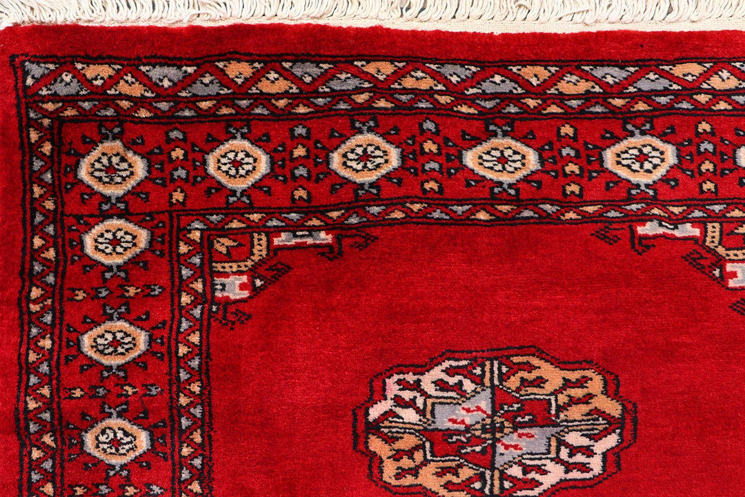 Red Pakistani Bokhara Rug 2' 7" x 9' 9" Hand-Knotted | No. QA20673